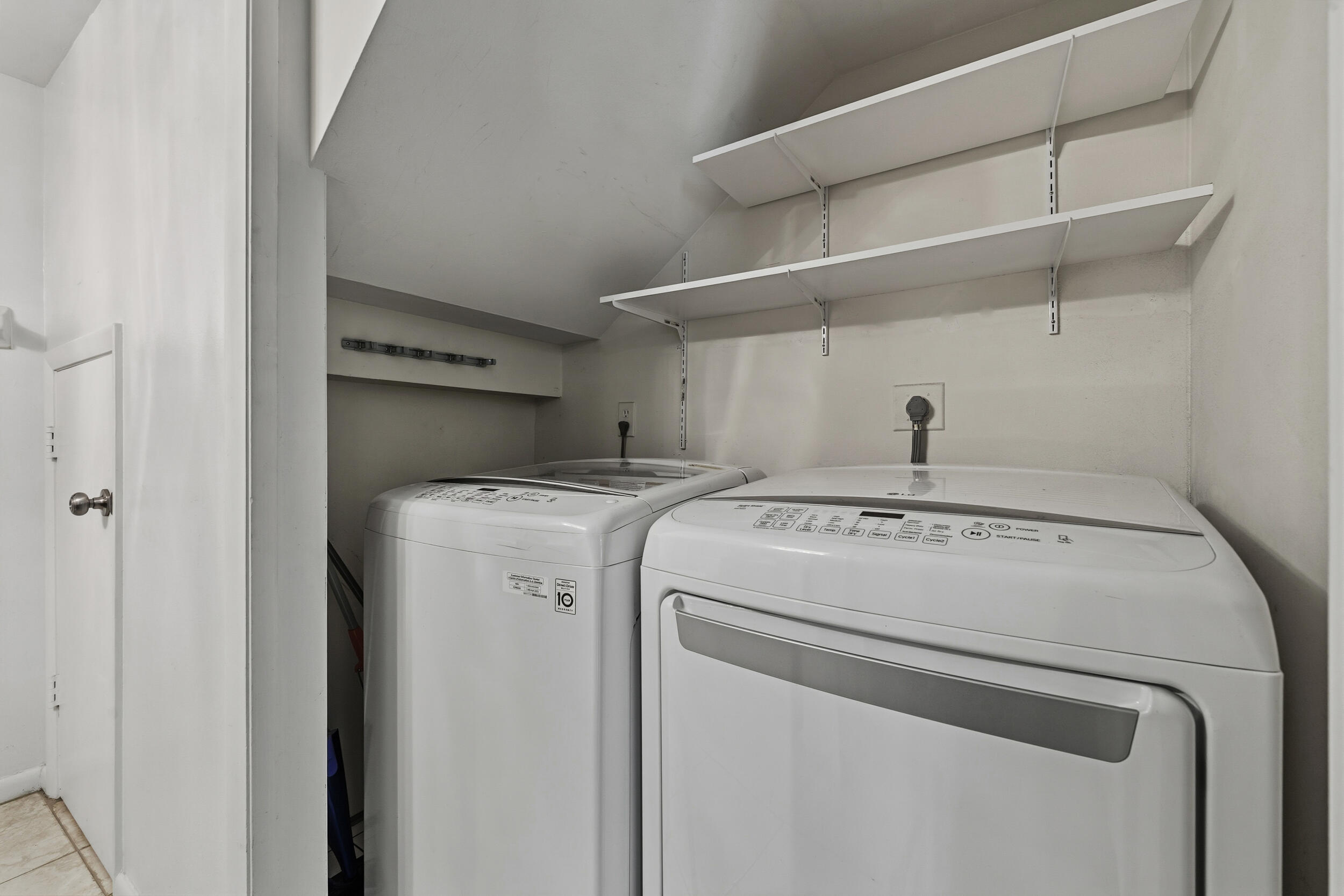 3852 Jefferson Street Stuart, FL 34997 - Photo 15 of 42 a utility room with dryer and washer