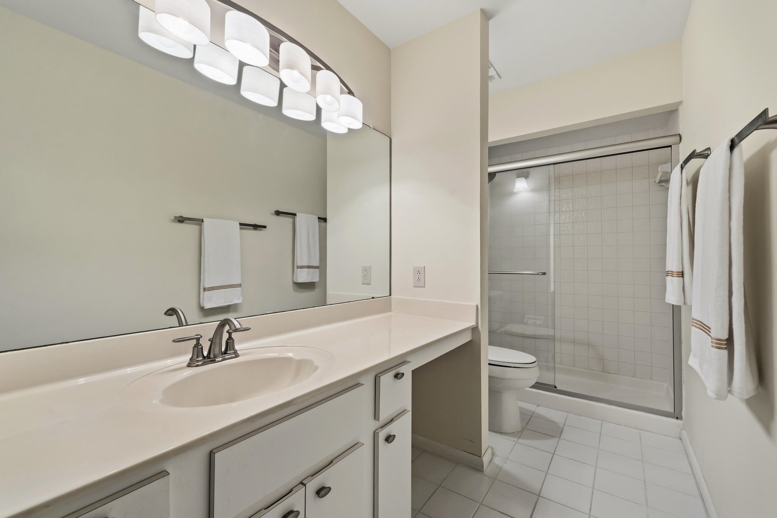 3852 Jefferson Street Stuart, FL 34997 - Photo 17 of 42 a bathroom with a sink a toilet and shower