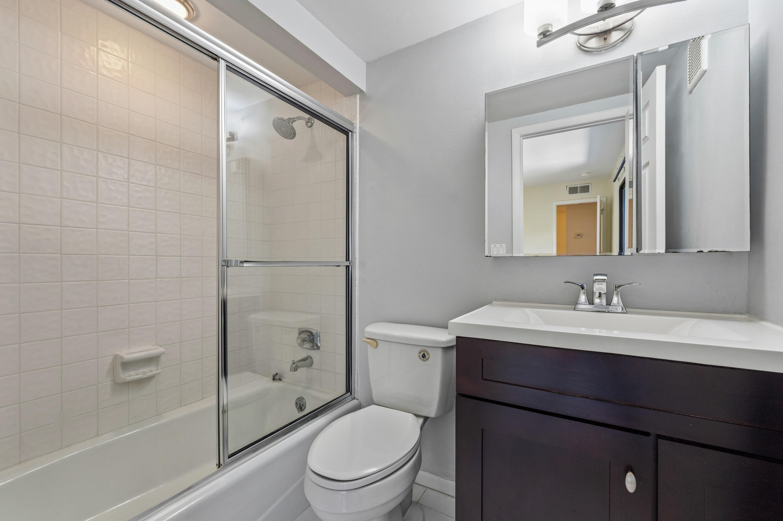 3852 Jefferson Street Stuart, FL 34997 - Photo 24 of 42 a bathroom with a toilet a sink and a bathtub