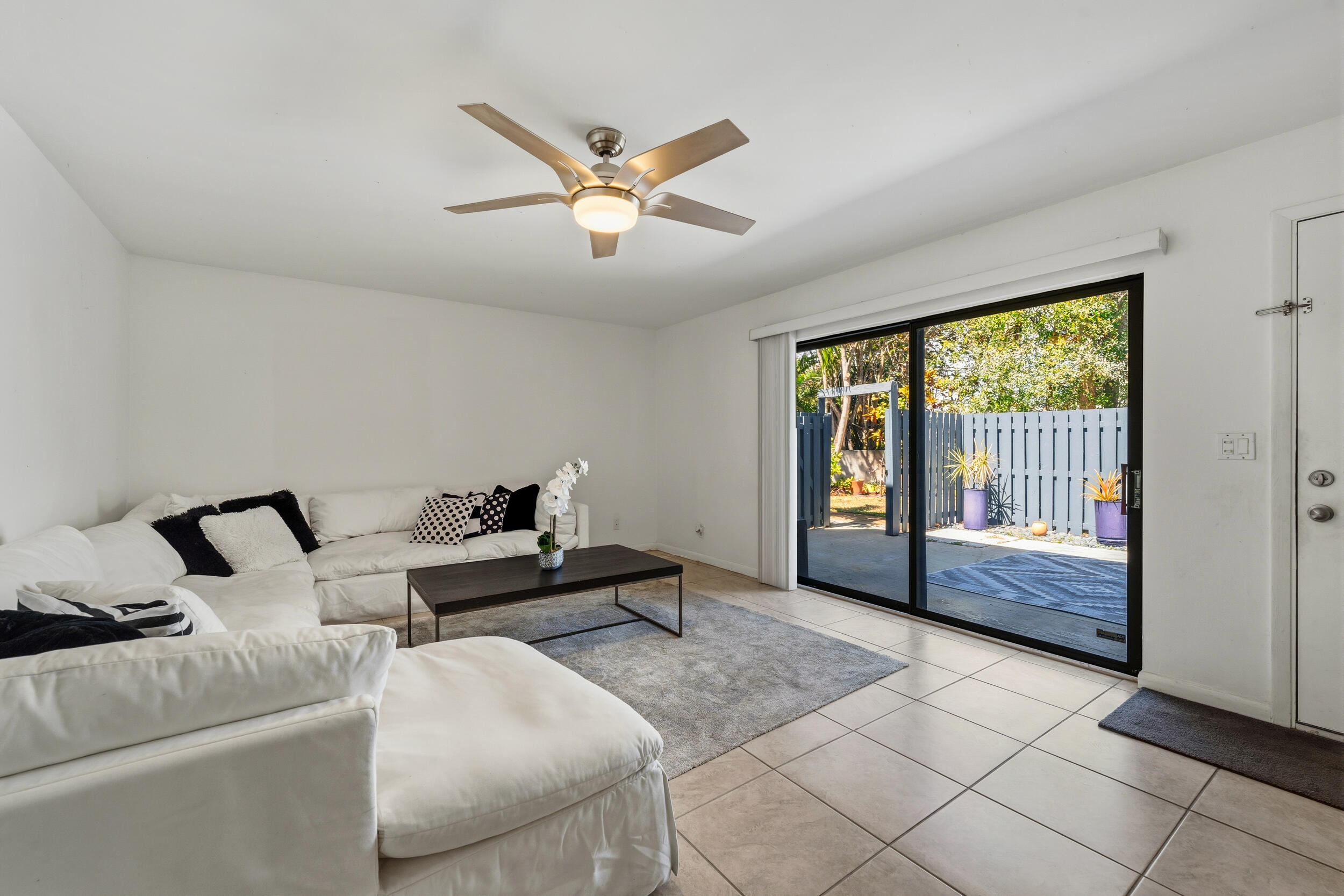 3852 Jefferson Street Stuart, FL 34997 - Photo 5 of 42 a living room with furniture and a large window