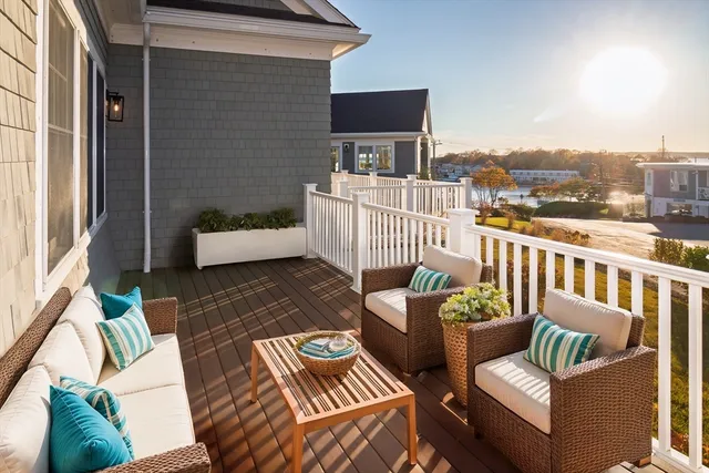 a view of a patio with couches chairs and a potted plant