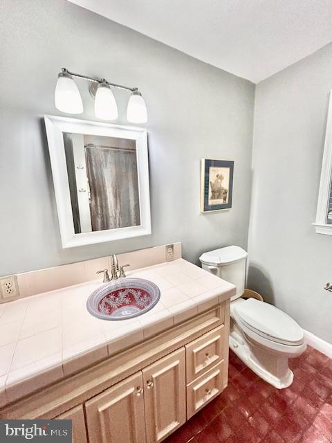 510 Washington Grove Lane Washington Grove, MD 20880 - Photo 16 of 45 a bathroom with a sink a toilet and mirror