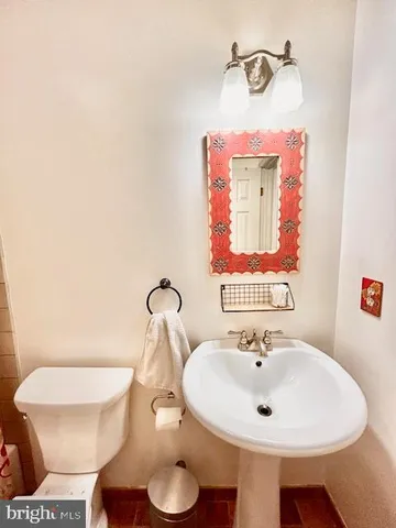 a bathroom with a sink and a toilet
