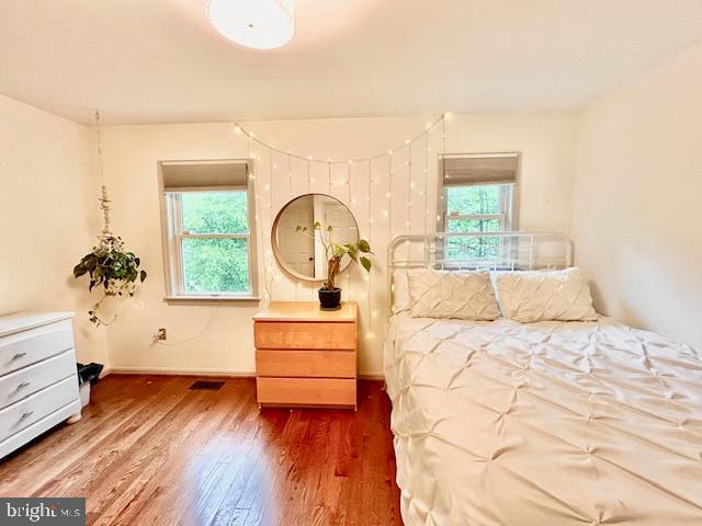 510 Washington Grove Lane Washington Grove, MD 20880 - Photo 23 of 45 a bedroom with a large bed and a dresser