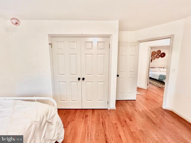 510 Washington Grove Lane Washington Grove, MD 20880 - Photo 25 of 45 a view of a bedroom with wooden floor and closet