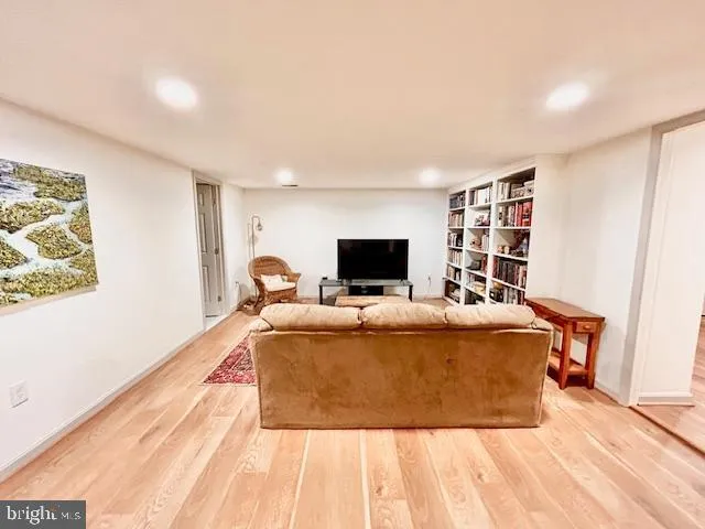 a living room with a couch and a flat screen tv