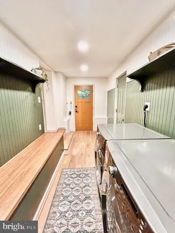 a spacious bathroom with a granite countertop sink and a large mirror