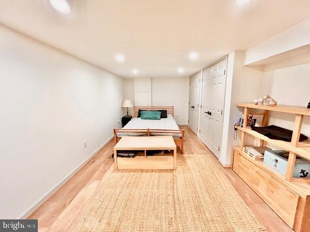 510 Washington Grove Lane Washington Grove, MD 20880 - Photo 37 of 45 a room with a bed and a wooden floor