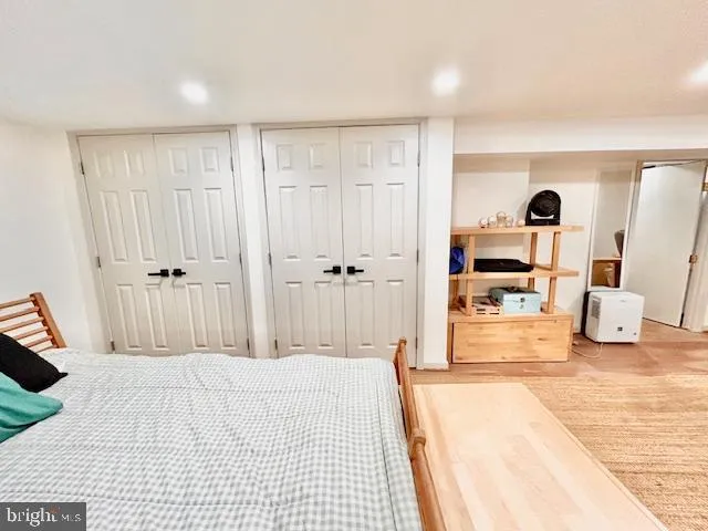 a bedroom with a bed and a lamp