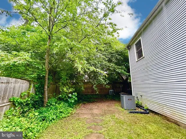 a view of a back yard of the house