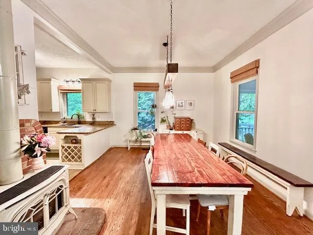 a very nice looking room with a large window and furniture