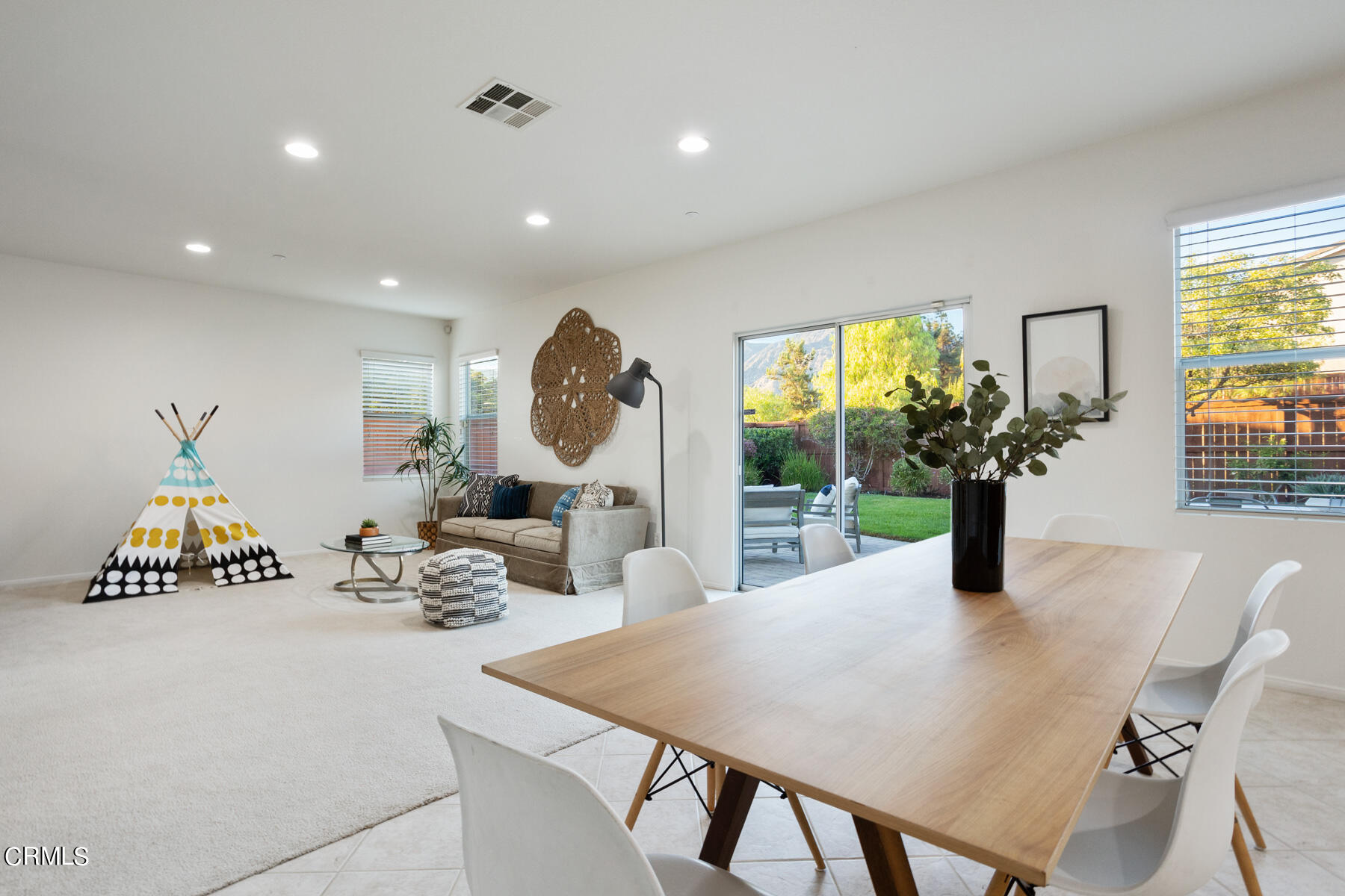 12435 Serrano Way Sylmar, CA 91342 - Photo 7 of 19 a view of a dining room with furniture and a potted plant