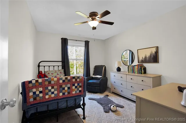 a bedroom with furniture and window