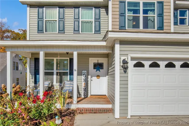 front view of a house with a potted plant