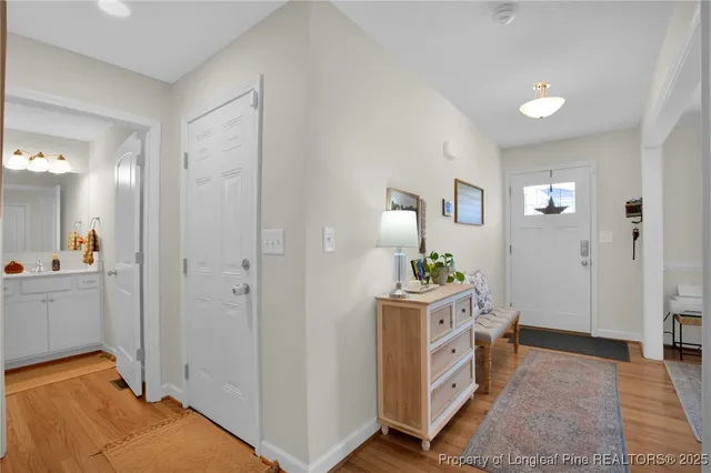 a room with a sink and a bed