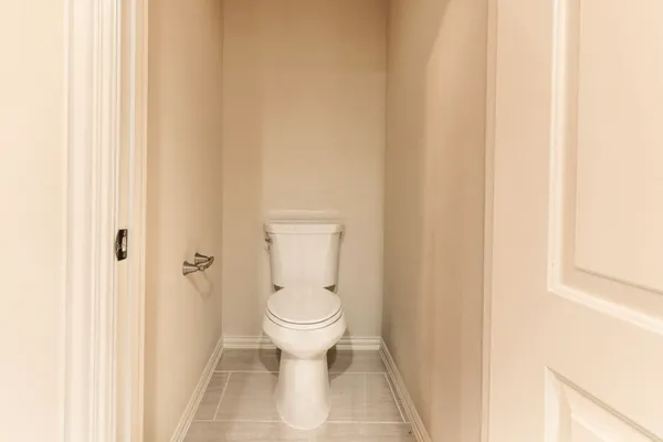 a bathroom with a toilet and a sink