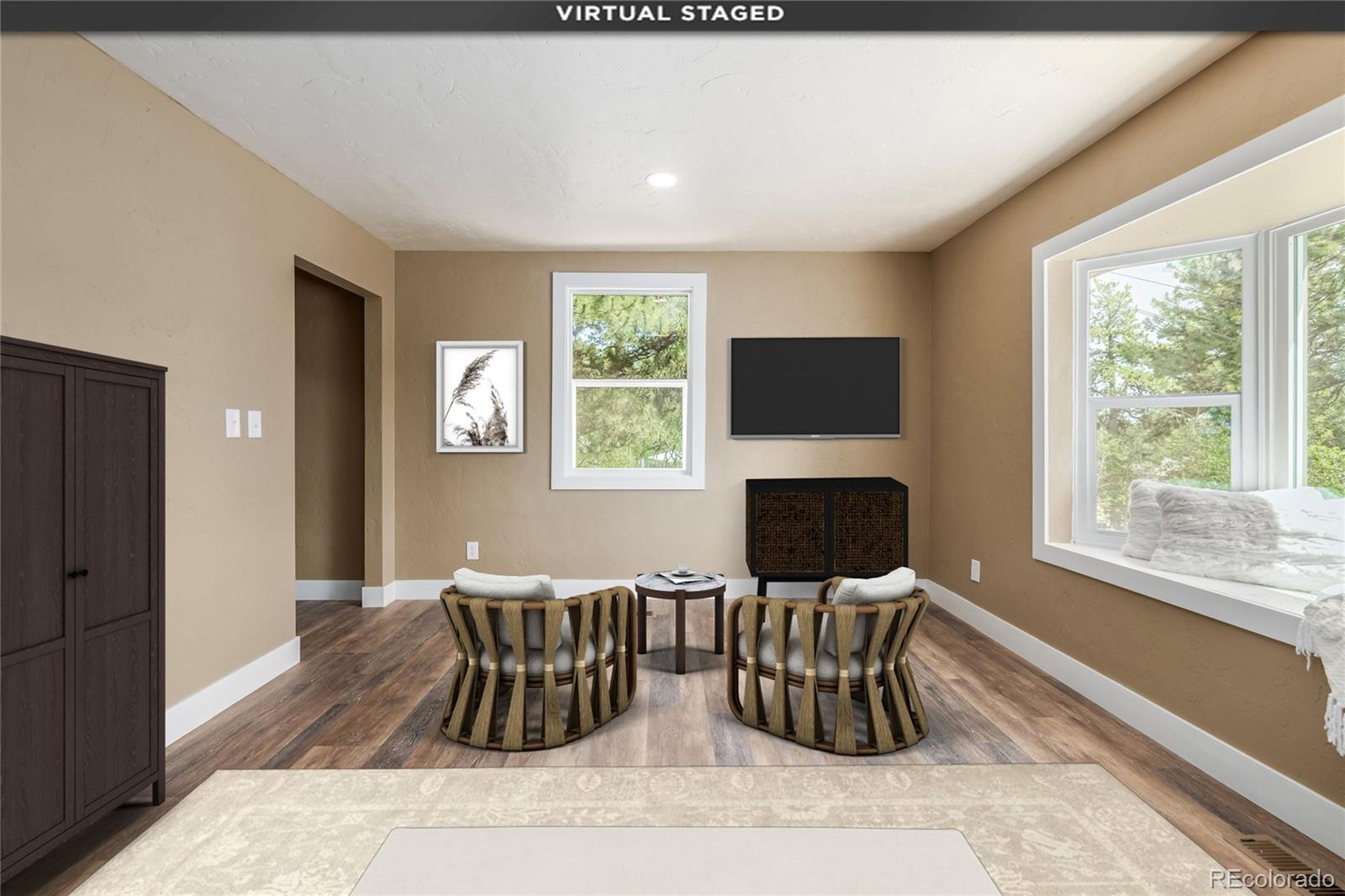 363 Neal Road Bailey, CO 80421 - Photo 12 of 39 a living room with furniture a large window and a flat screen tv