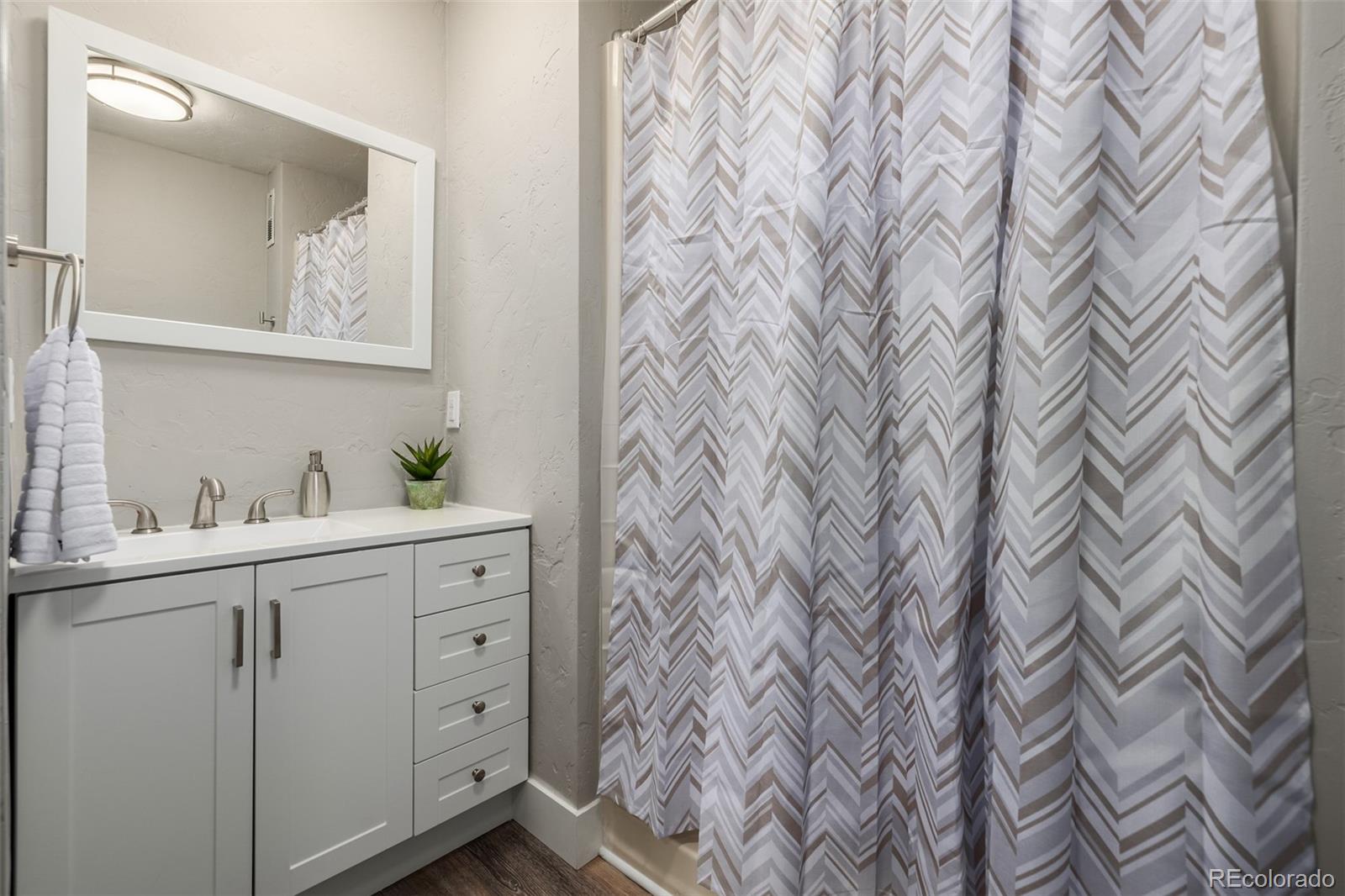 363 Neal Road Bailey, CO 80421 - Photo 20 of 39 a bathroom with a sink and a mirror