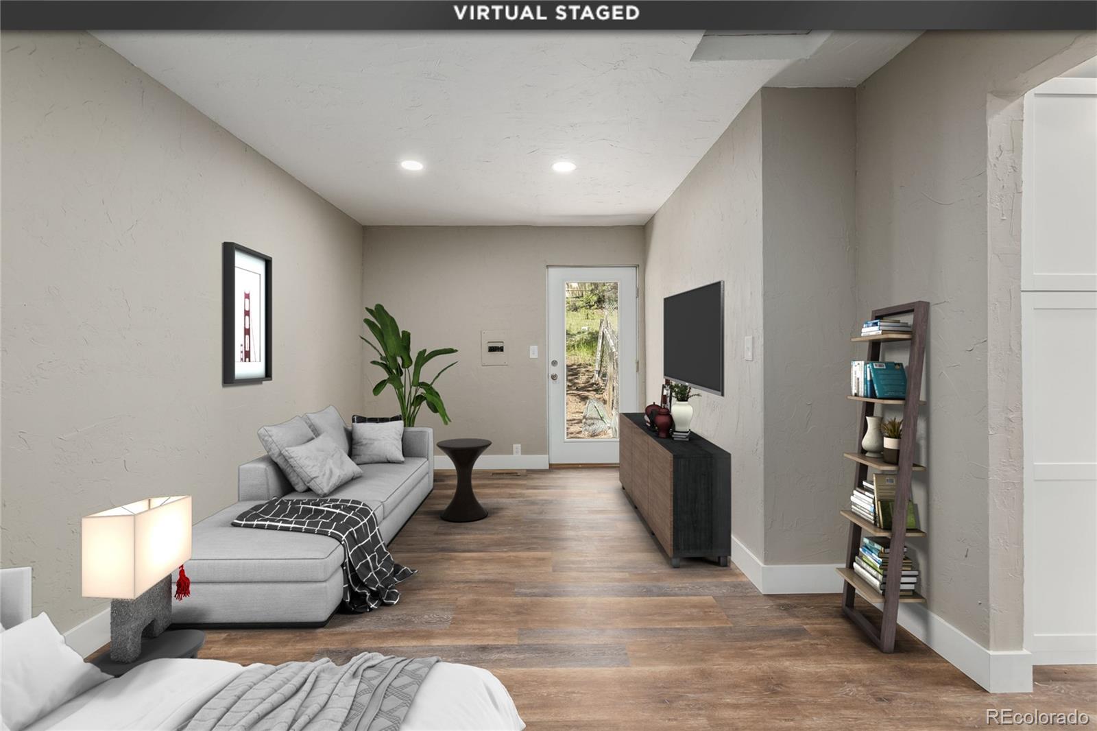 363 Neal Road Bailey, CO 80421 - Photo 24 of 39 a living room with furniture and a flat screen tv