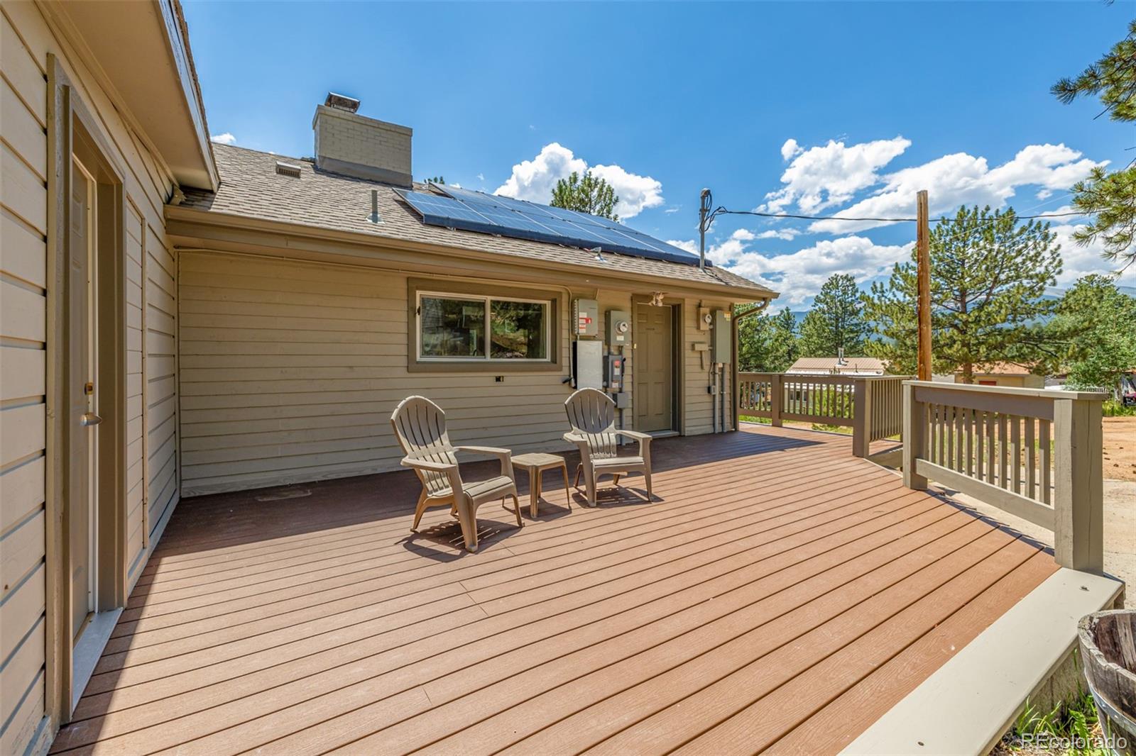 363 Neal Road Bailey, CO 80421 - Photo 3 of 39 a balcony view with a seating space
