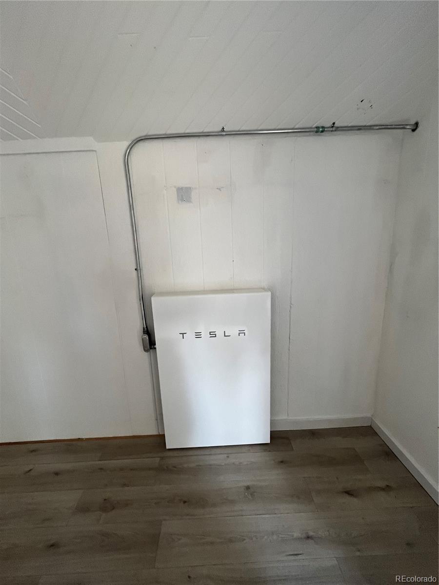 363 Neal Road Bailey, CO 80421 - Photo 35 of 39 a view of a utility room with wooden floor