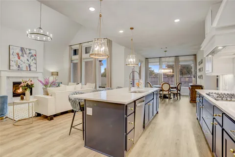 a dining room with furniture and wooden floor