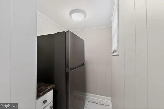 a bathroom with a shower and a sink