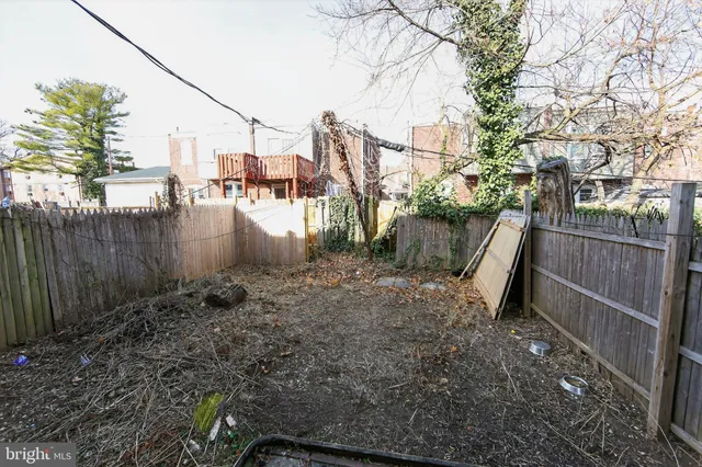 a view of a yard next to a lake