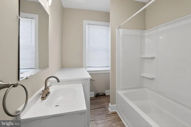 a bathroom with a sink and a bathtub