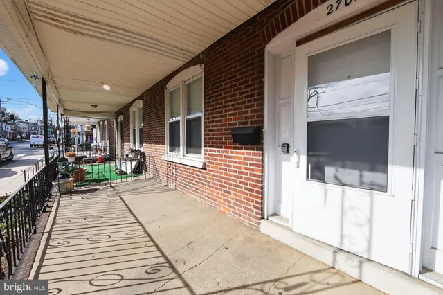 a lobby with furniture and a rug