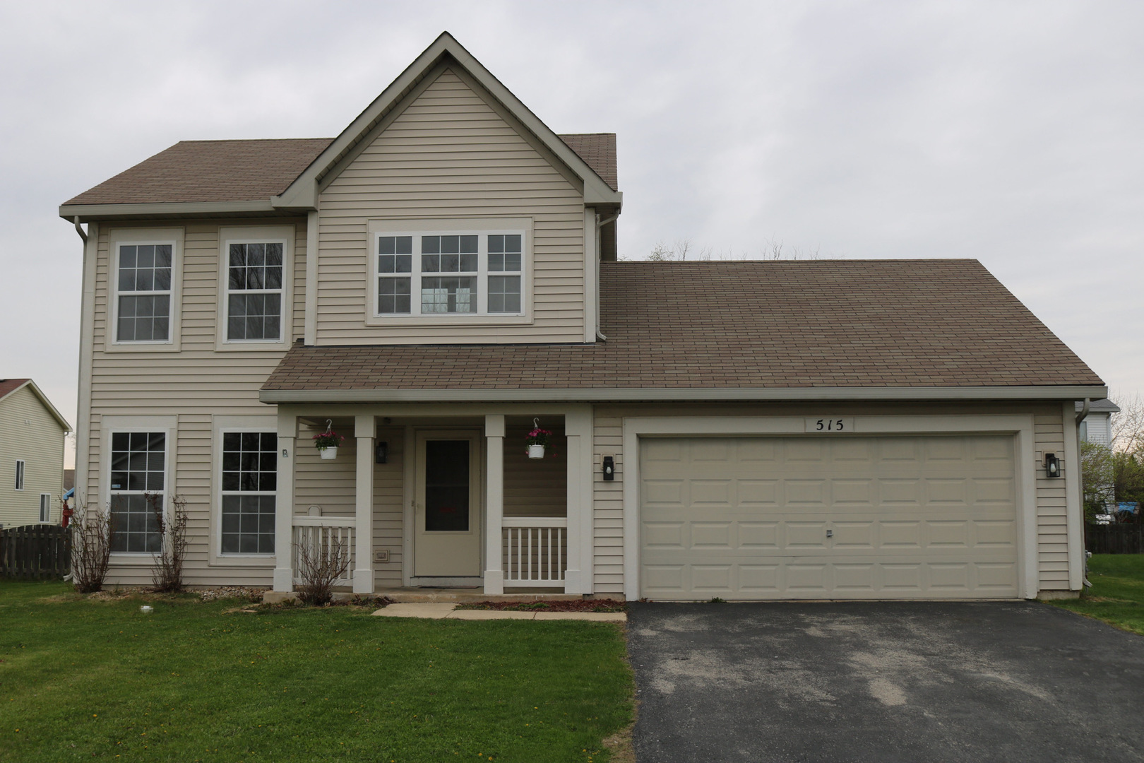 515 May Street Plano, IL 60545 - Photo 1 of 14 a front view of a house with a yard and garage