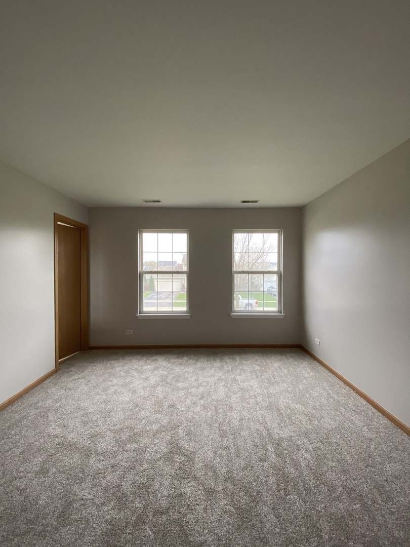 515 May Street Plano, IL 60545 - Photo 12 of 14 an empty room with windows