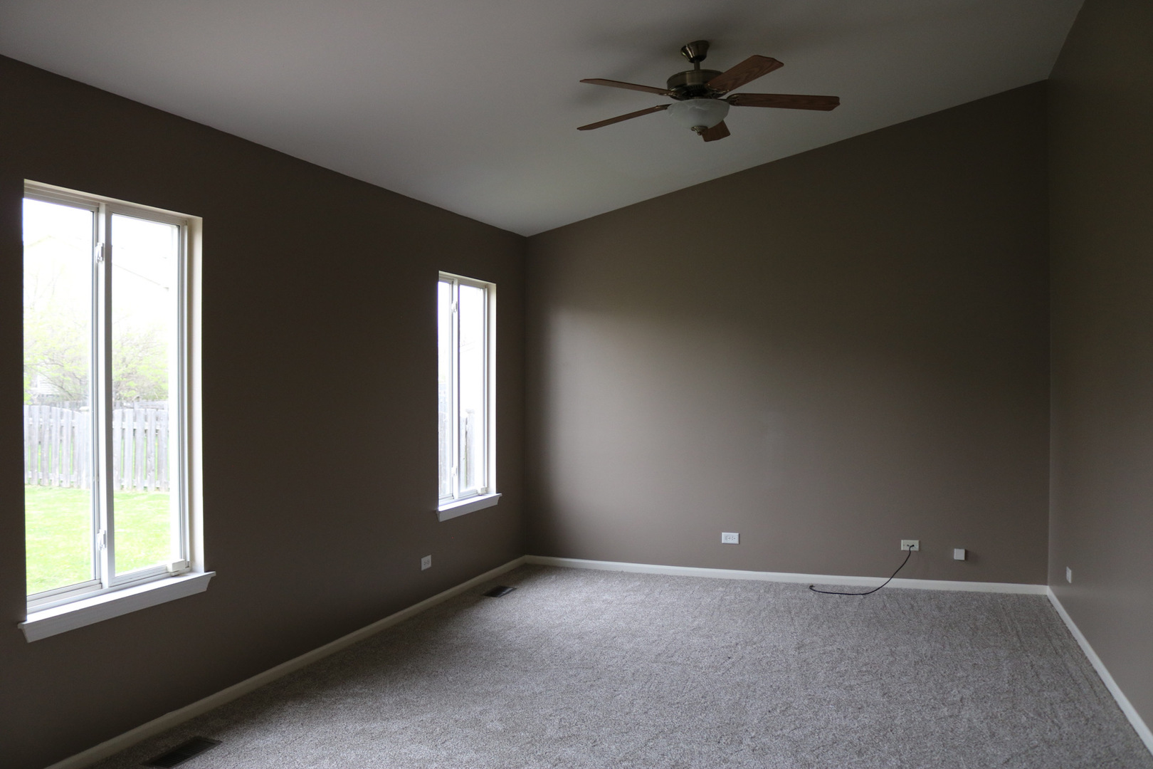 515 May Street Plano, IL 60545 - Photo 7 of 14 a view of an empty room with a window