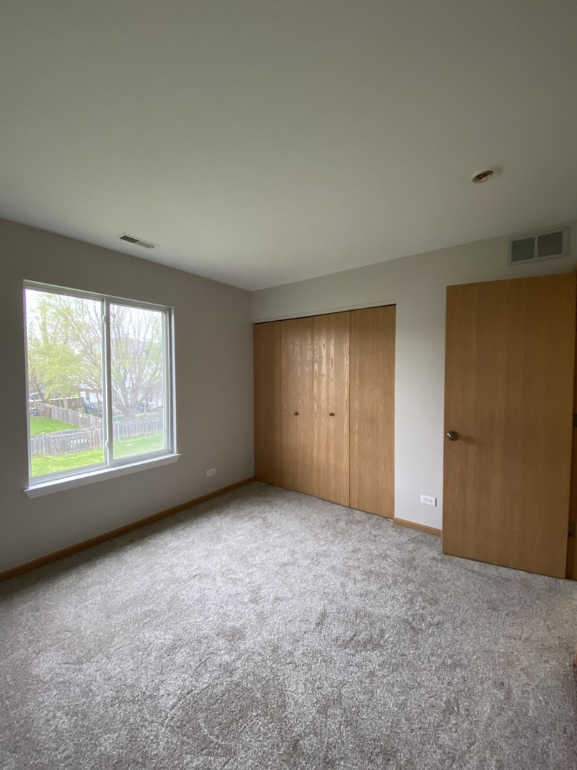 515 May Street Plano, IL 60545 - Photo 9 of 14 an empty room with a window