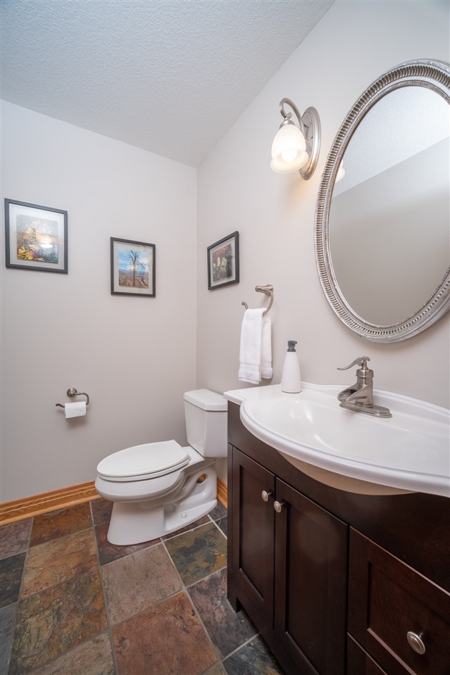 2685 Rogene Drive Oregon, IL 61061 - Photo 17 of 40 a bathroom with a toilet a sink and mirror