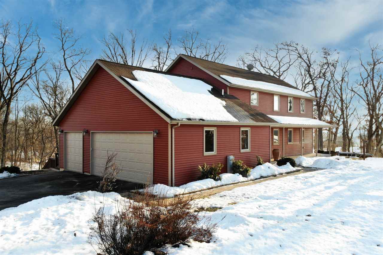 2685 Rogene Drive Oregon, IL 61061 - Photo 3 of 40 a front view of a house with a yard covered in snow