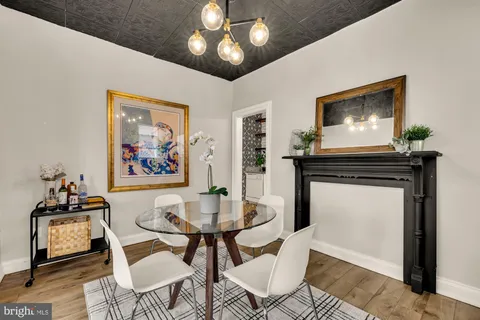 a dining room with furniture and window