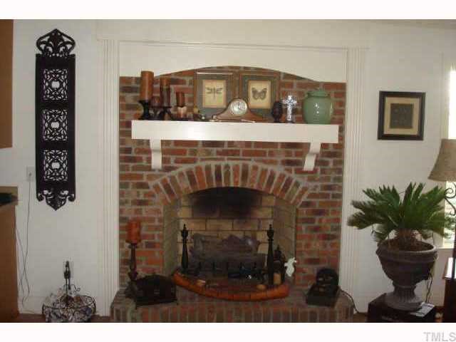325 Meadow Road Kenly, NC 27542 - Photo 6 of 10 This BREAKFAST area has an all BRICK hearth and BEAUTIFUL ARCHED GAS LOG fireplace to ACCENT the ARCHED DOORWAYS! The painted mantle makes it POP!