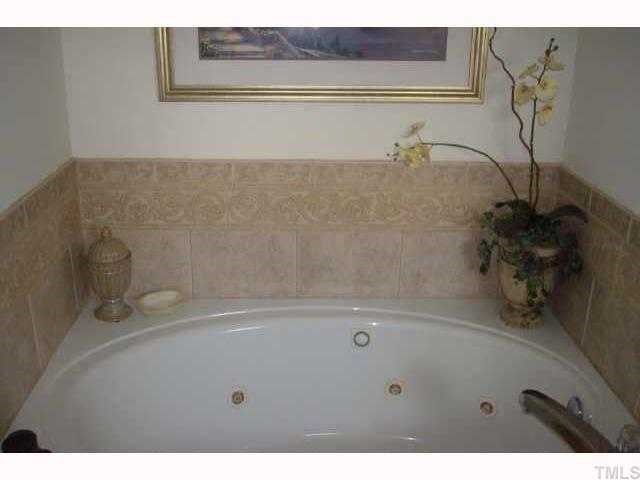 325 Meadow Road Kenly, NC 27542 - Photo 8 of 10 LOOK at this LUXURIOUS JETTED tub in the master bath! CERAMIC TILE floors and a SEPARATE shower are also presented here!