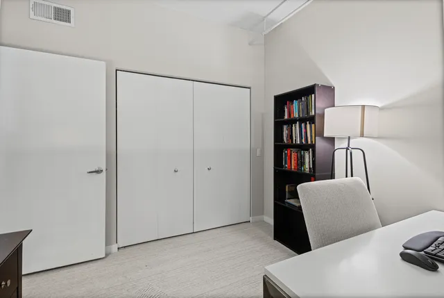 a view of a livingroom with furniture and closet