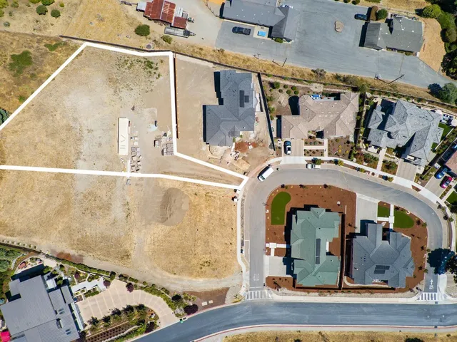 an aerial view of a house with a swimming pool
