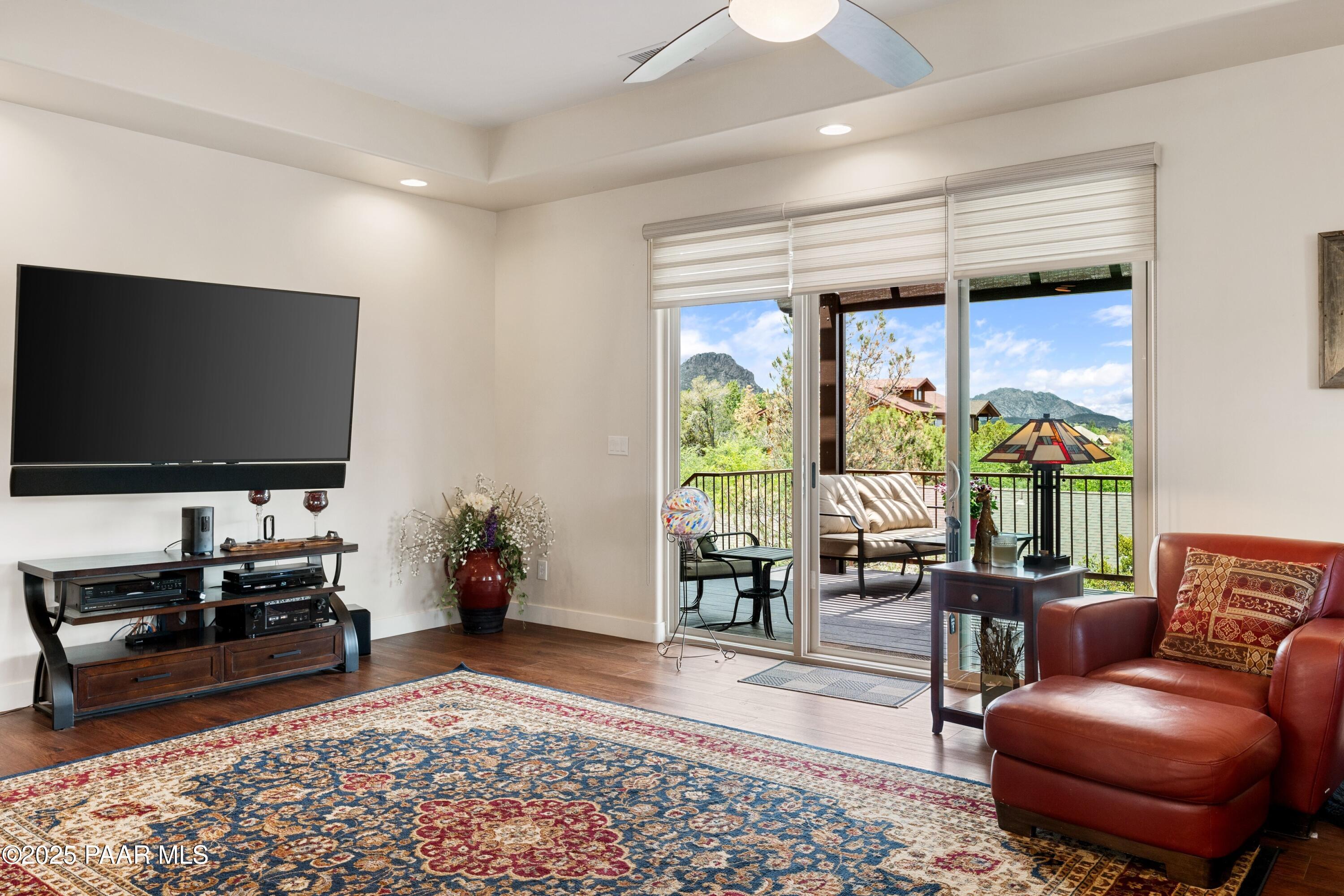 1468 Butte Road Prescott, AZ 86303 - Photo 12 of 31 a living room with furniture and a flat screen tv