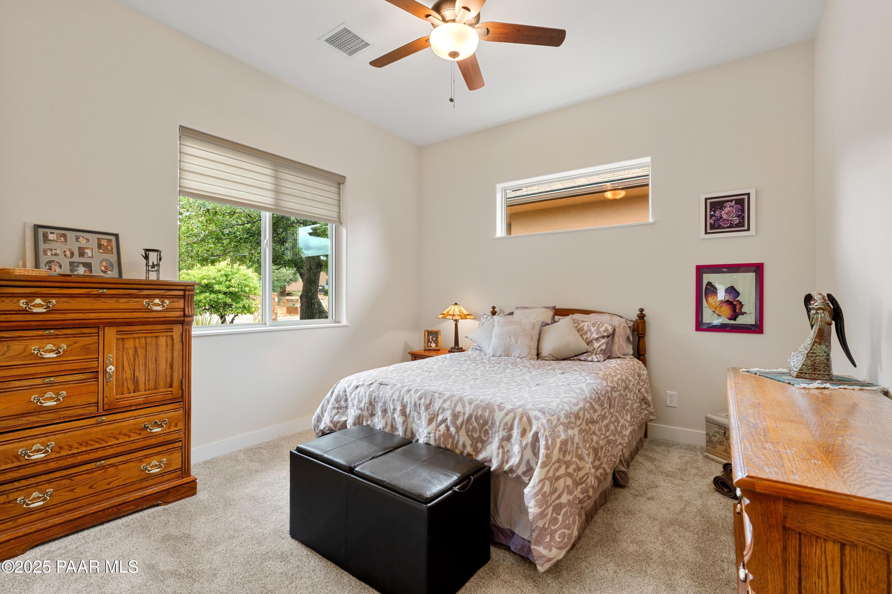 1468 Butte Road Prescott, AZ 86303 - Photo 21 of 31 a bedroom with a bed and a dresser