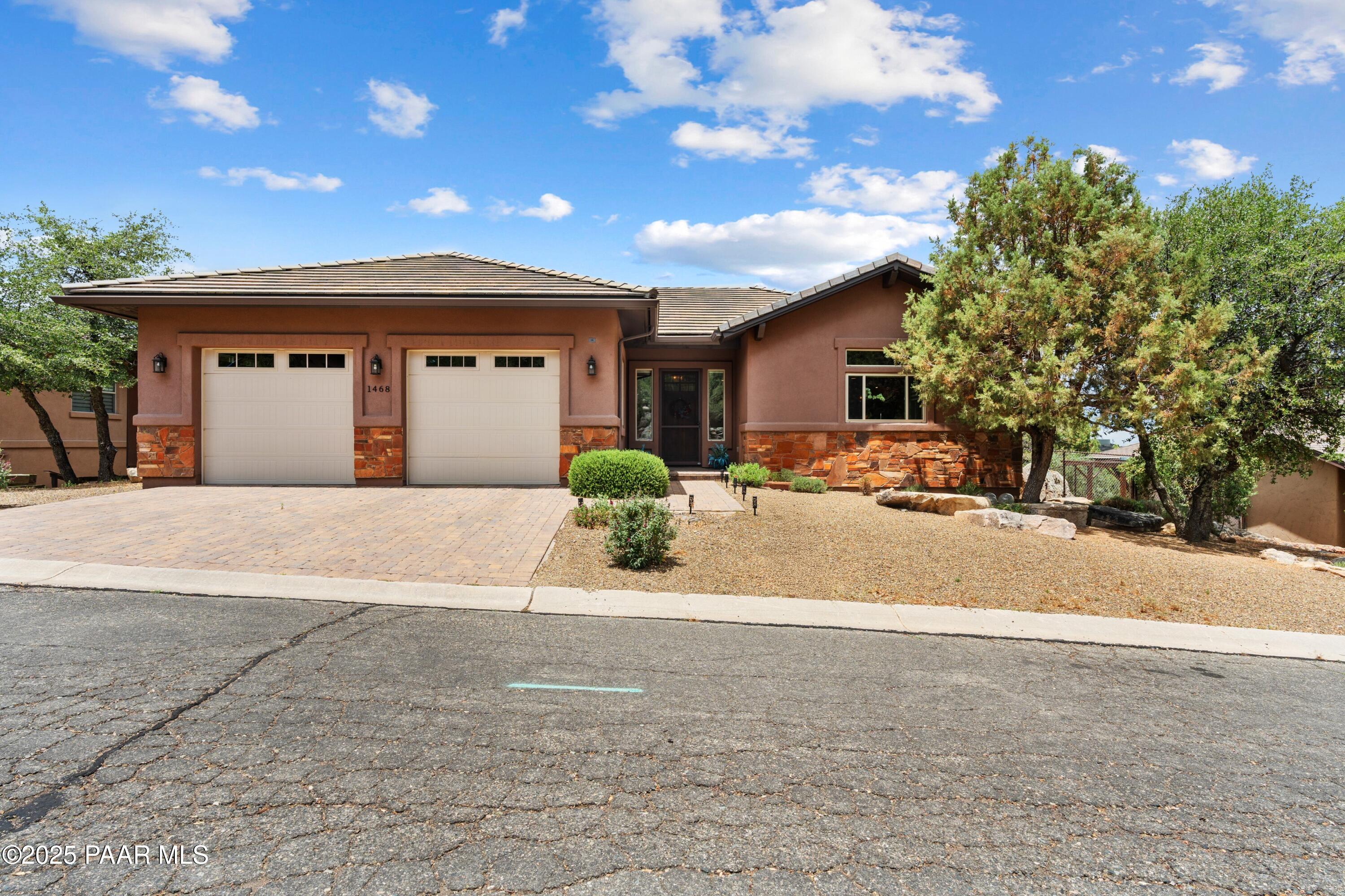 1468 Butte Road Prescott, AZ 86303 - Photo 28 of 31 a front view of a house with a yard and garage