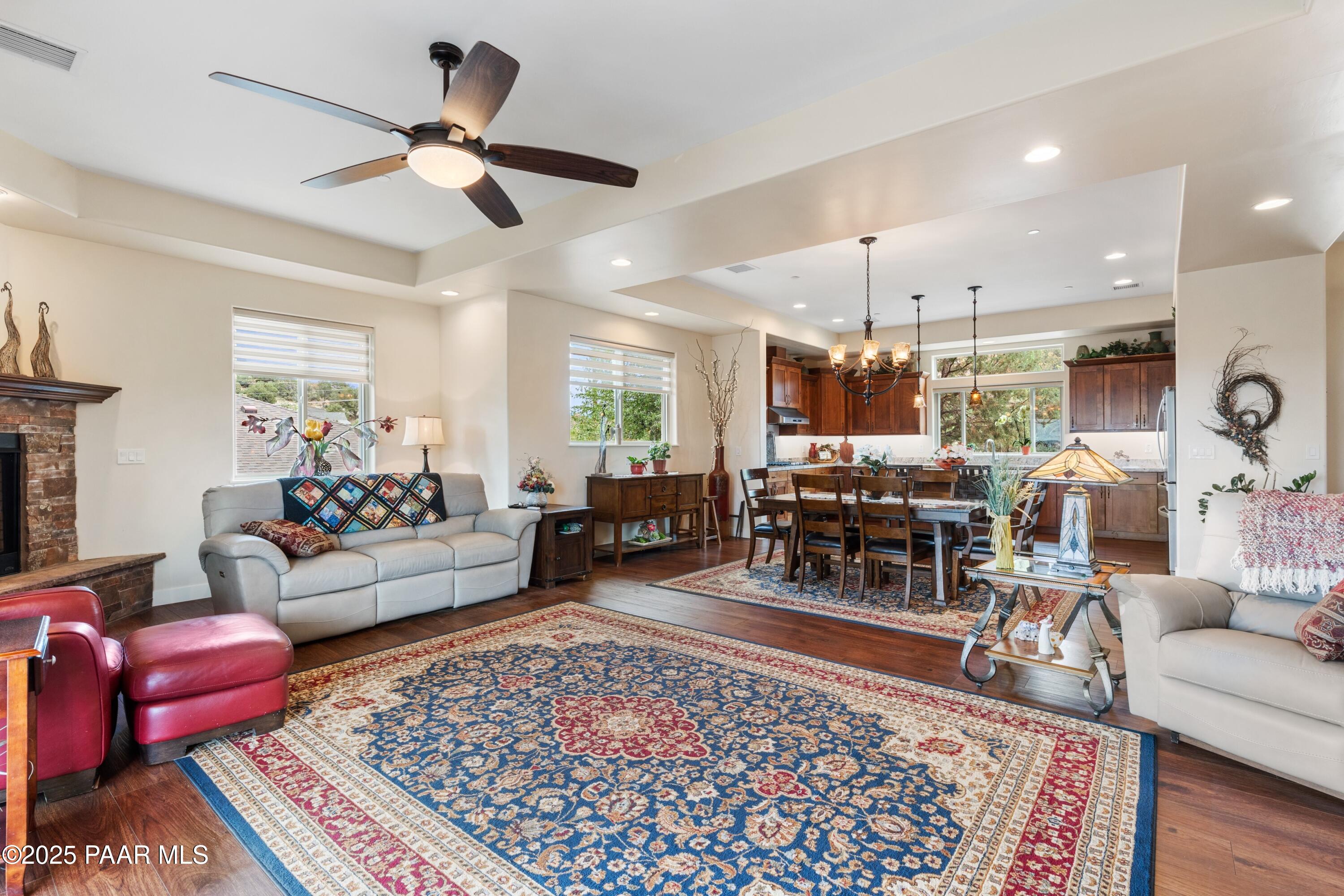 1468 Butte Road Prescott, AZ 86303 - Photo 6 of 31 a living room with lots of furniture and wooden floor