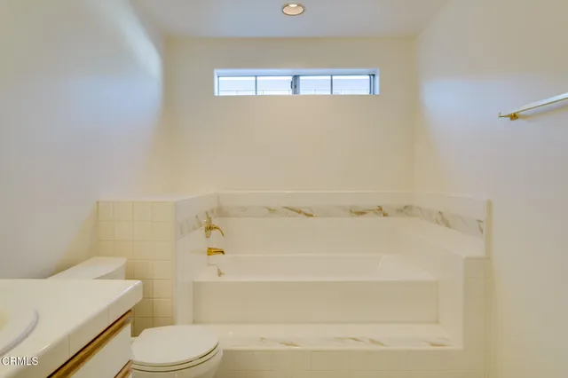 a bathroom with a sink double vanity and a mirror