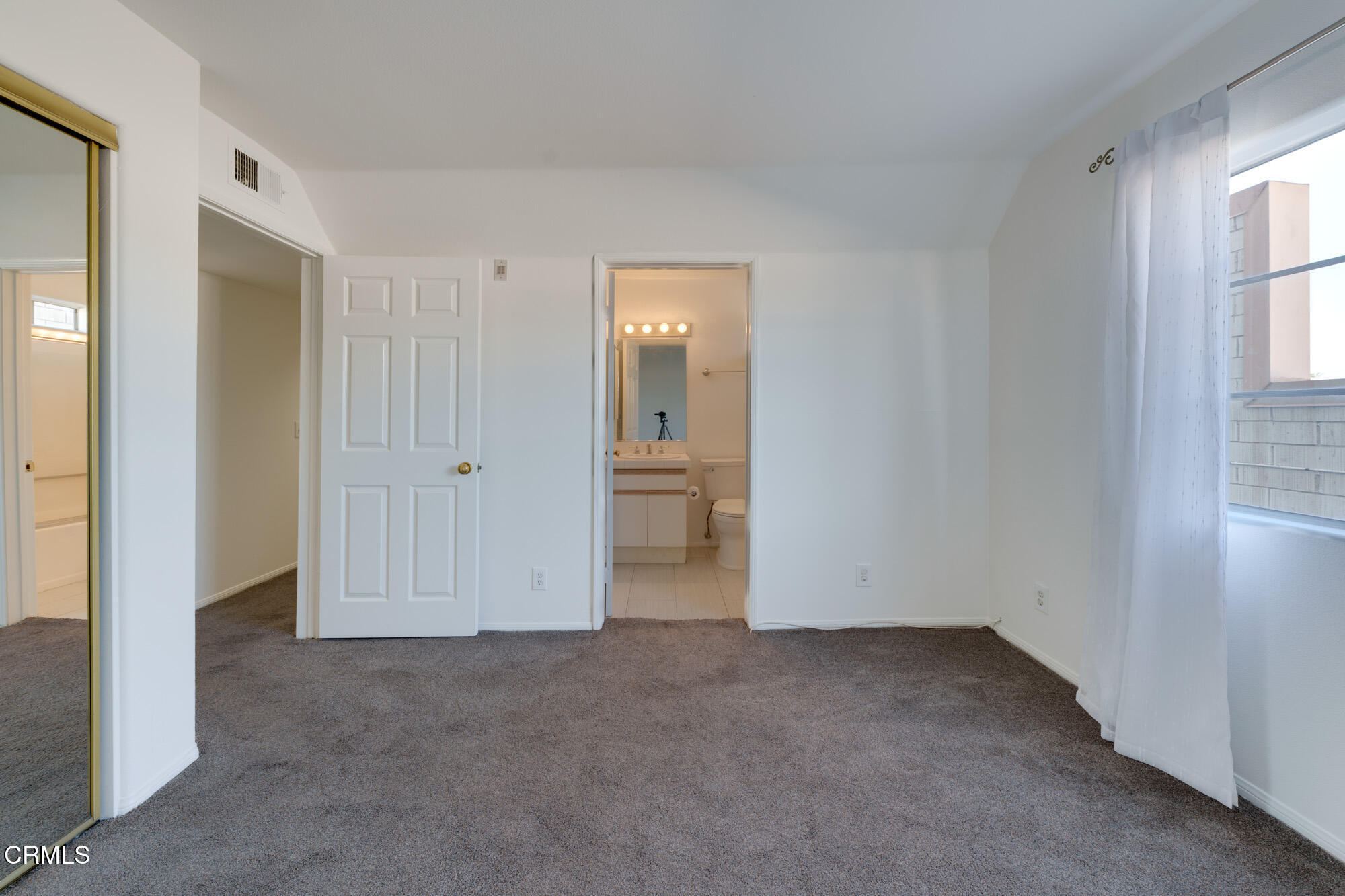 10925 Blix Street, Unit 102 Toluca Lake, CA 91602 - Photo 17 of 29 an empty room with windows and closet