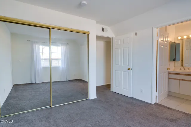 a bathroom with a granite countertop toilet sink and shower