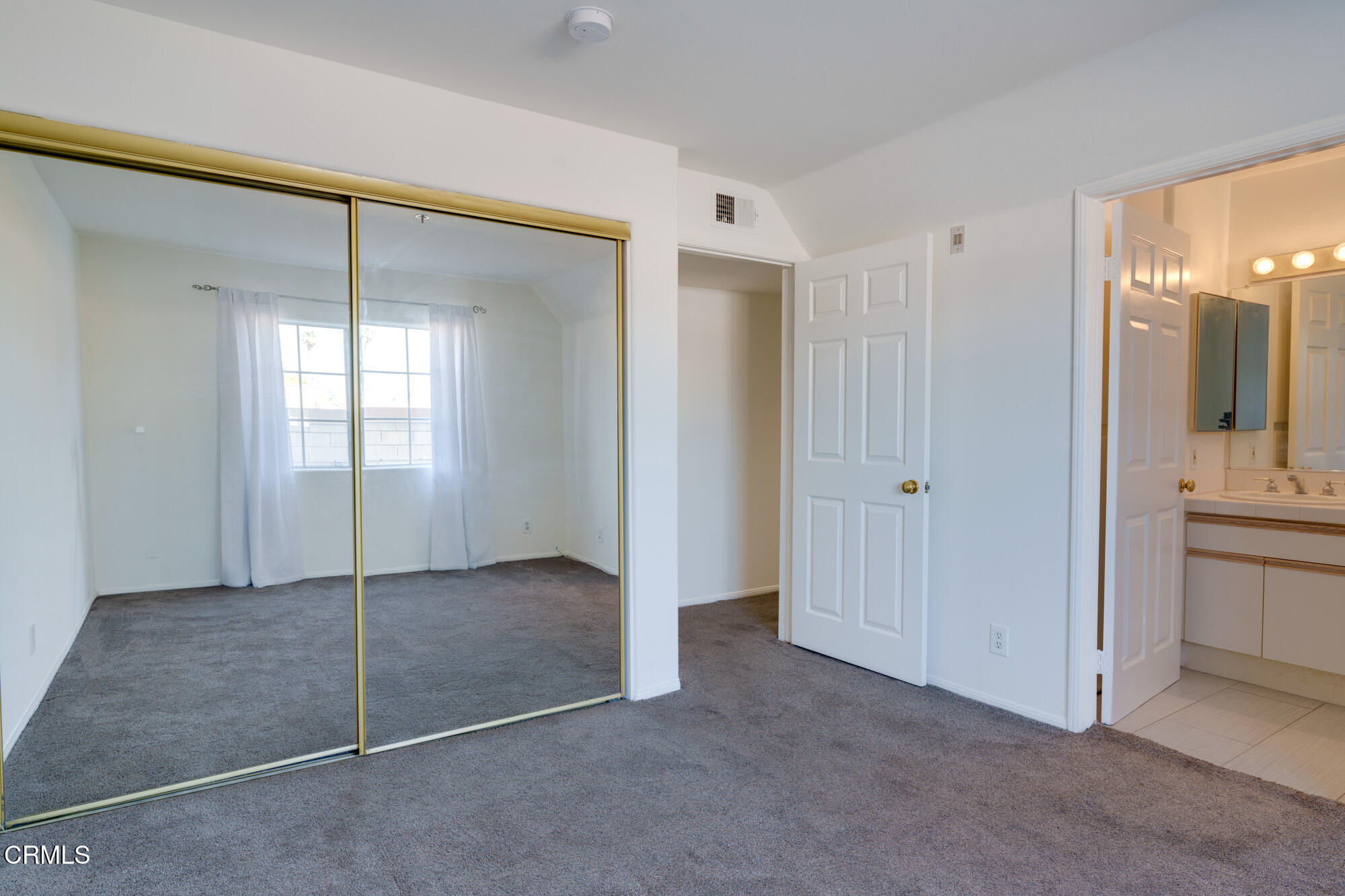 10925 Blix Street, Unit 102 Toluca Lake, CA 91602 - Photo 18 of 29 a view of an empty room with window and bathroom