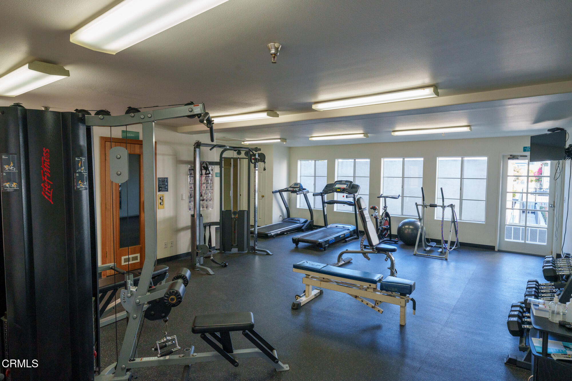 10925 Blix Street, Unit 102 Toluca Lake, CA 91602 - Photo 21 of 29 a view of a room with gym equipment